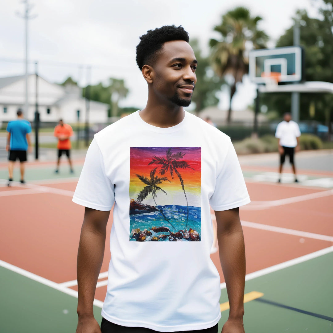 Man wearing a white t-shirt with a colorful graphic of palm trees and a beach scene on an outdoor basketball court.