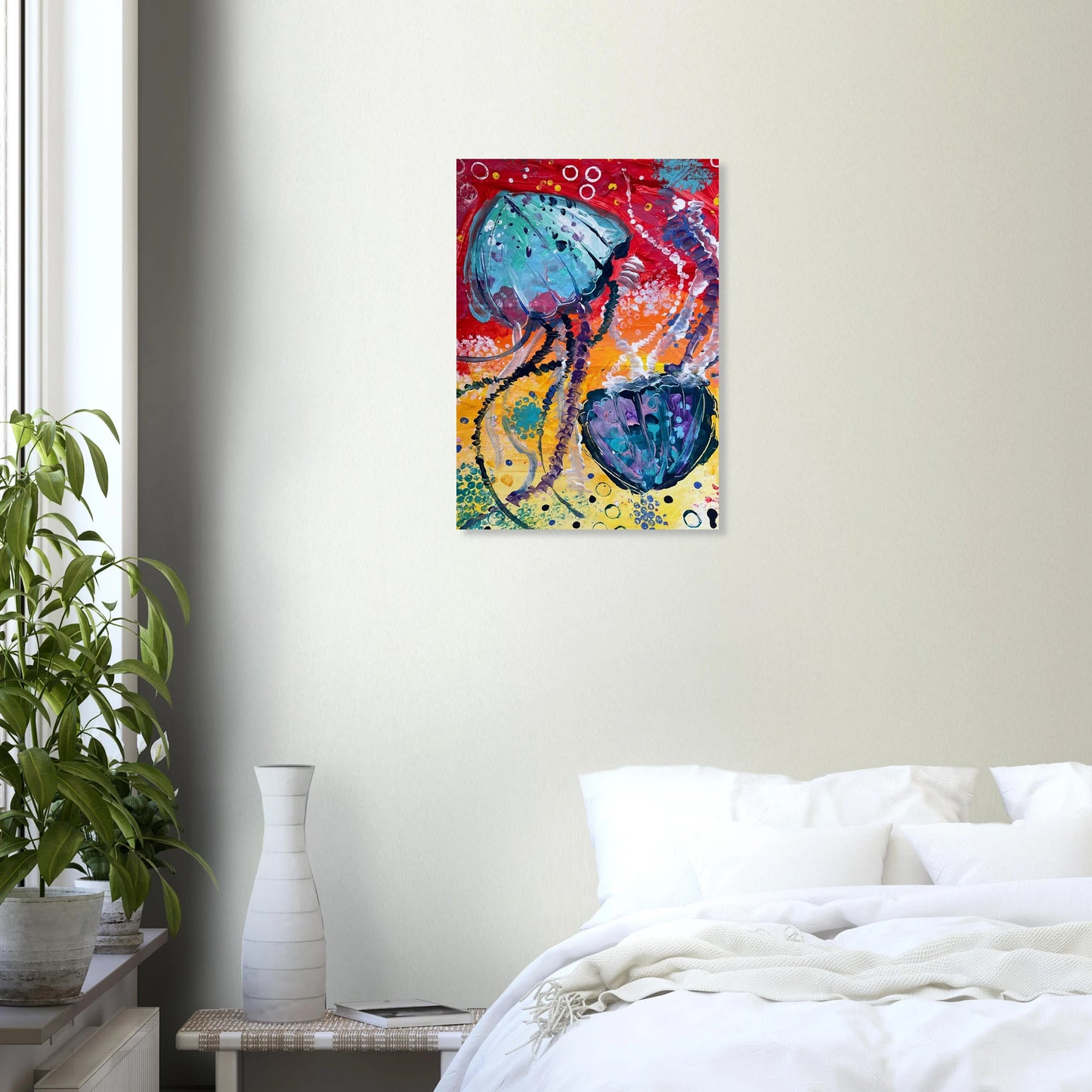 A colourful print of a jellyfish painting on a bedroom wall.
