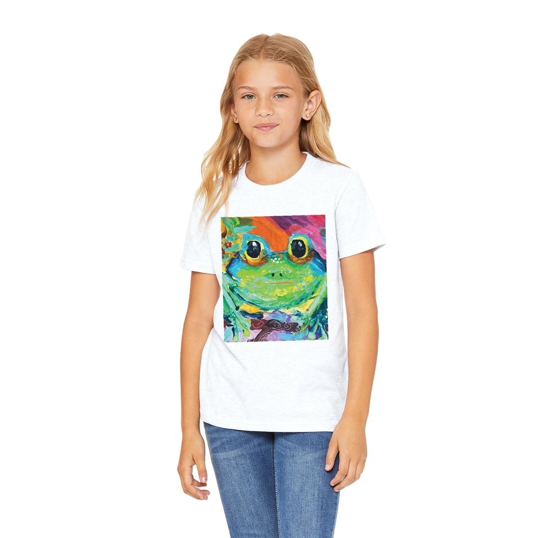 Young girl wearing a white t-shirt with a colorful frog graphic on a white background