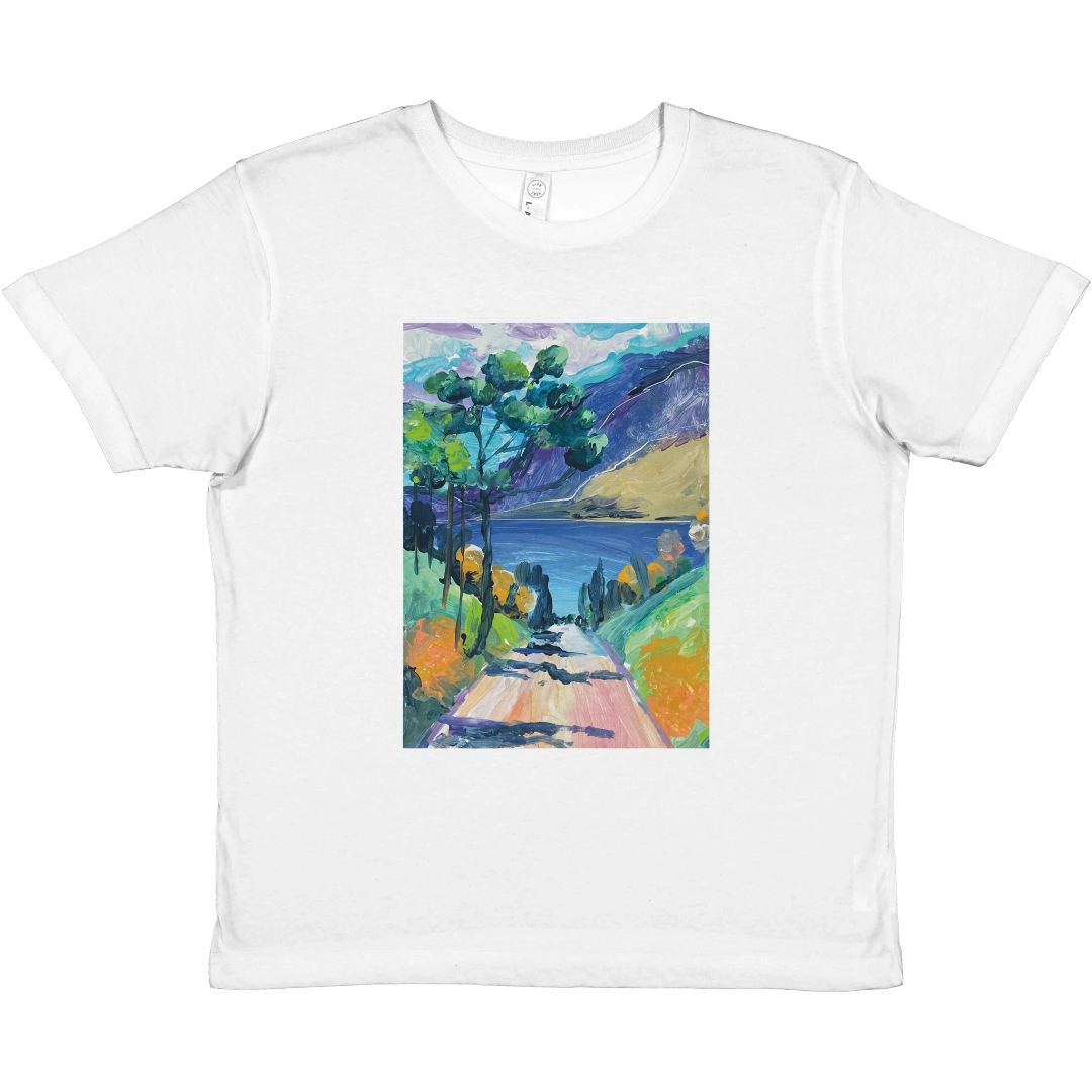 White t-shirt with a colorful landscape design on a white background