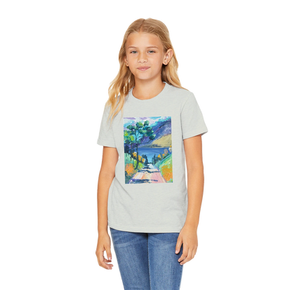 Girl wearing a grey t-shirt with a colorful nature graphic on a white background